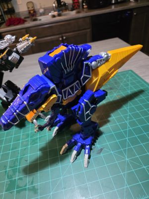 Blue and yellow dinosaur robot toy from Super Sentai collection.