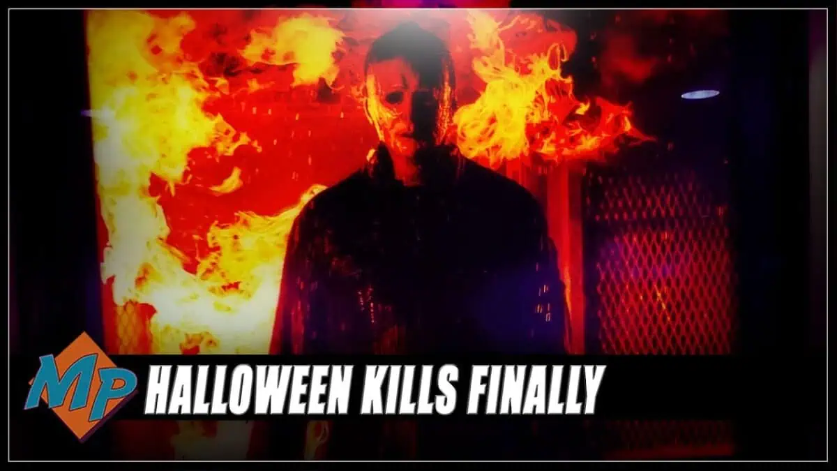 Dark figure in front of flames from Halloween Kills movie scene.