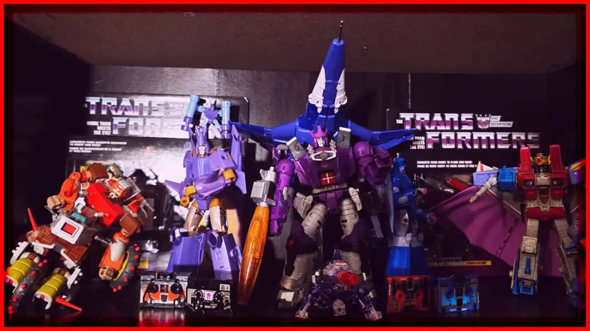 Collection of Transformers action figures on display shelf.