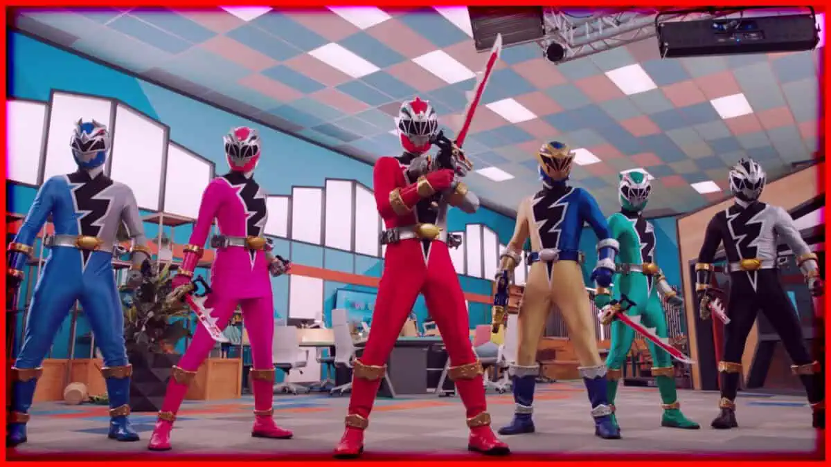 Power Rangers team in vibrant costumes posing with weapons in a modern indoor setting.