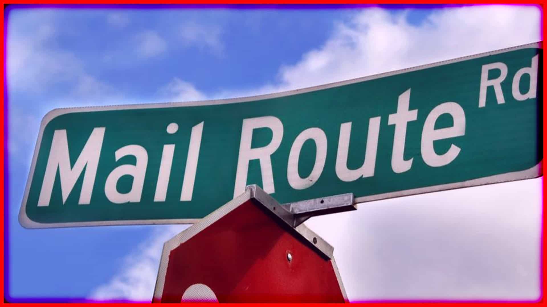 Mail Route street sign in clear view against a blue sky.