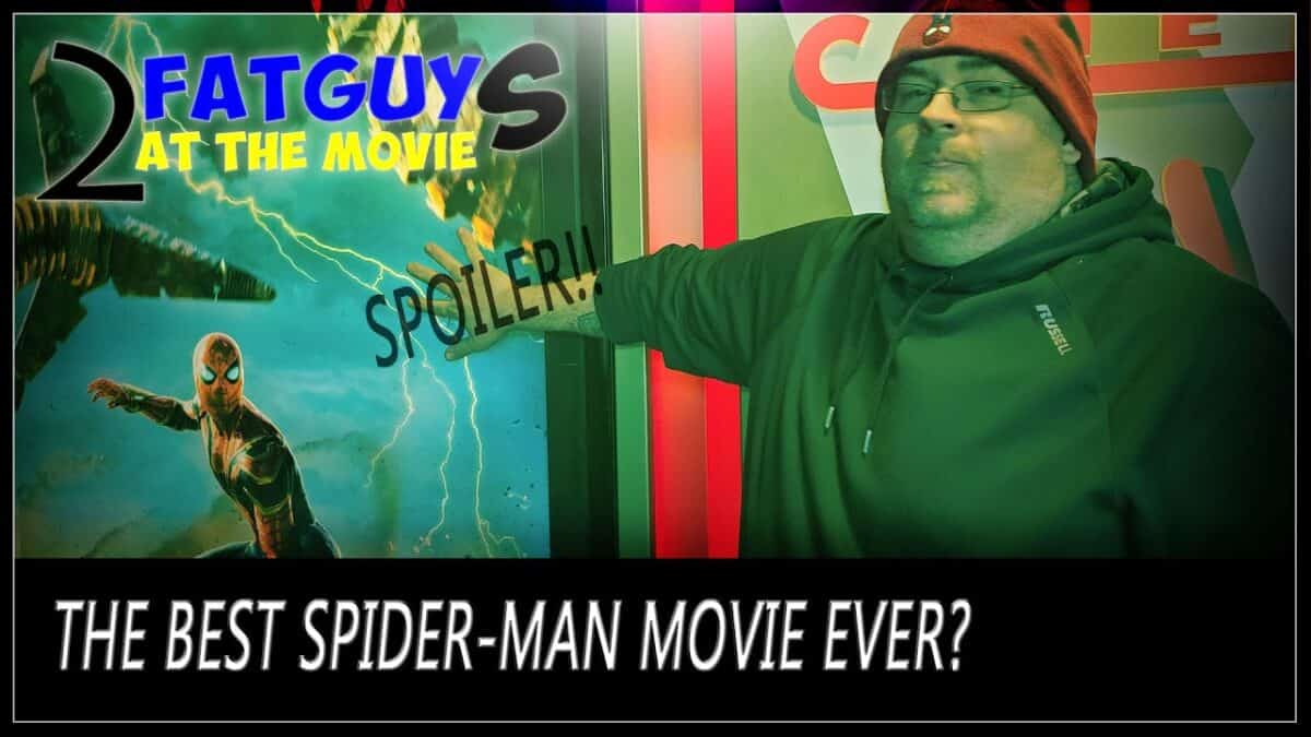 Man pointing at Spider-Man movie poster with spoiler warning.