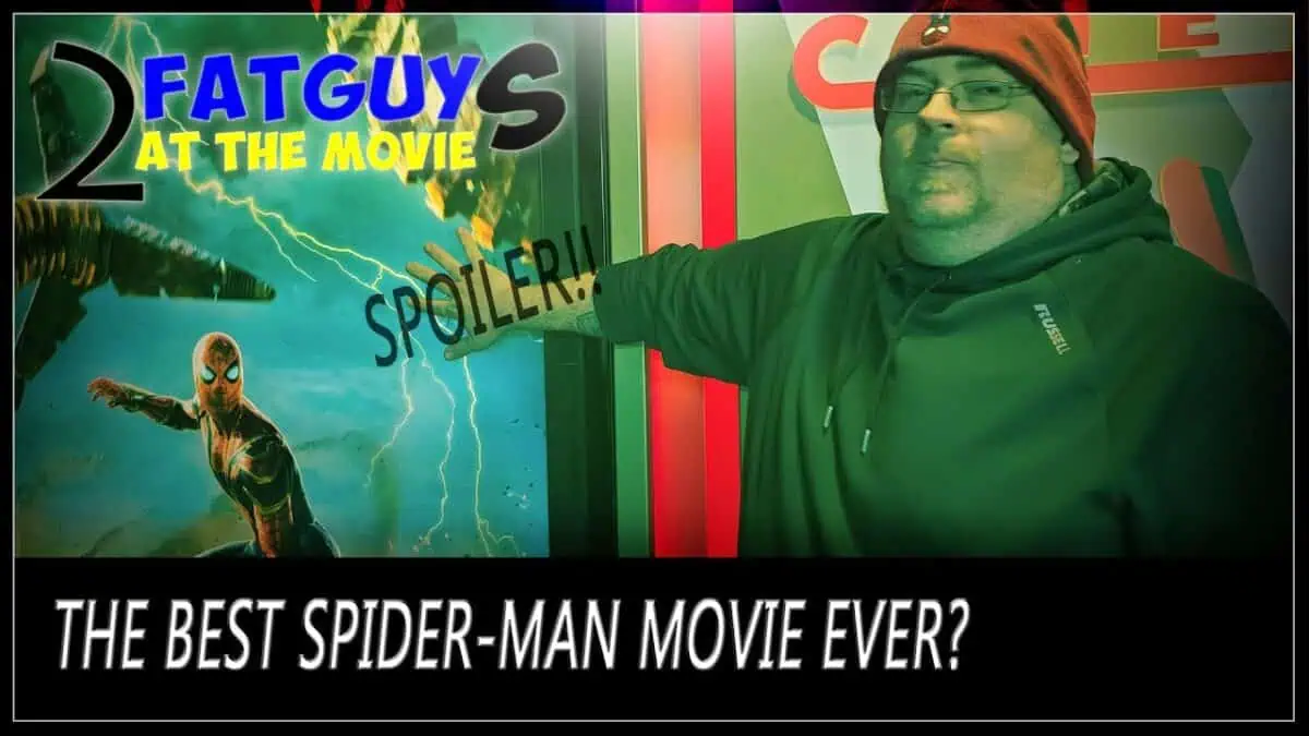 Man pointing at Spider-Man movie poster with spoiler warning.