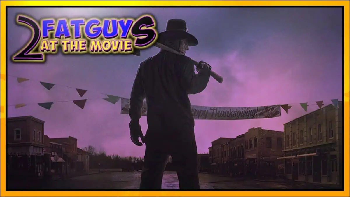 Silhouette of a man with a hat holding a bat in a spooky town setting.
