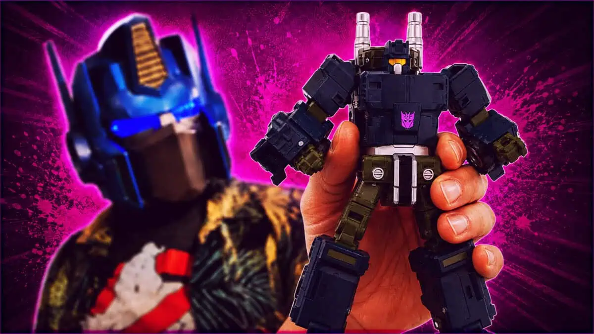 Majin Planet Bruticus Transformer Toy Hand holding a detailed Bruticus Transformer toy with a vibrant pink background.