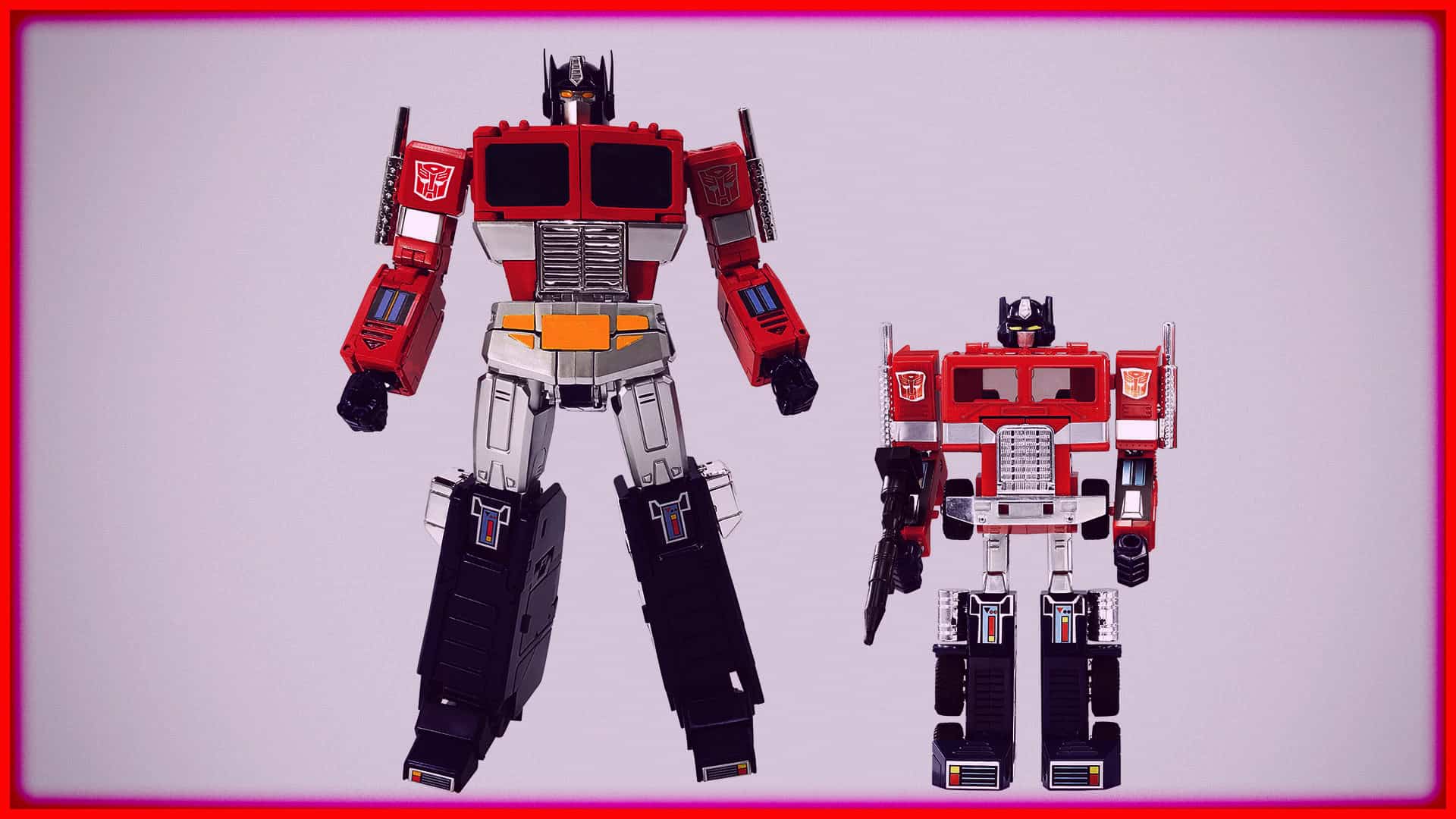Two Transformers action figures standing side by side on a plain background.
