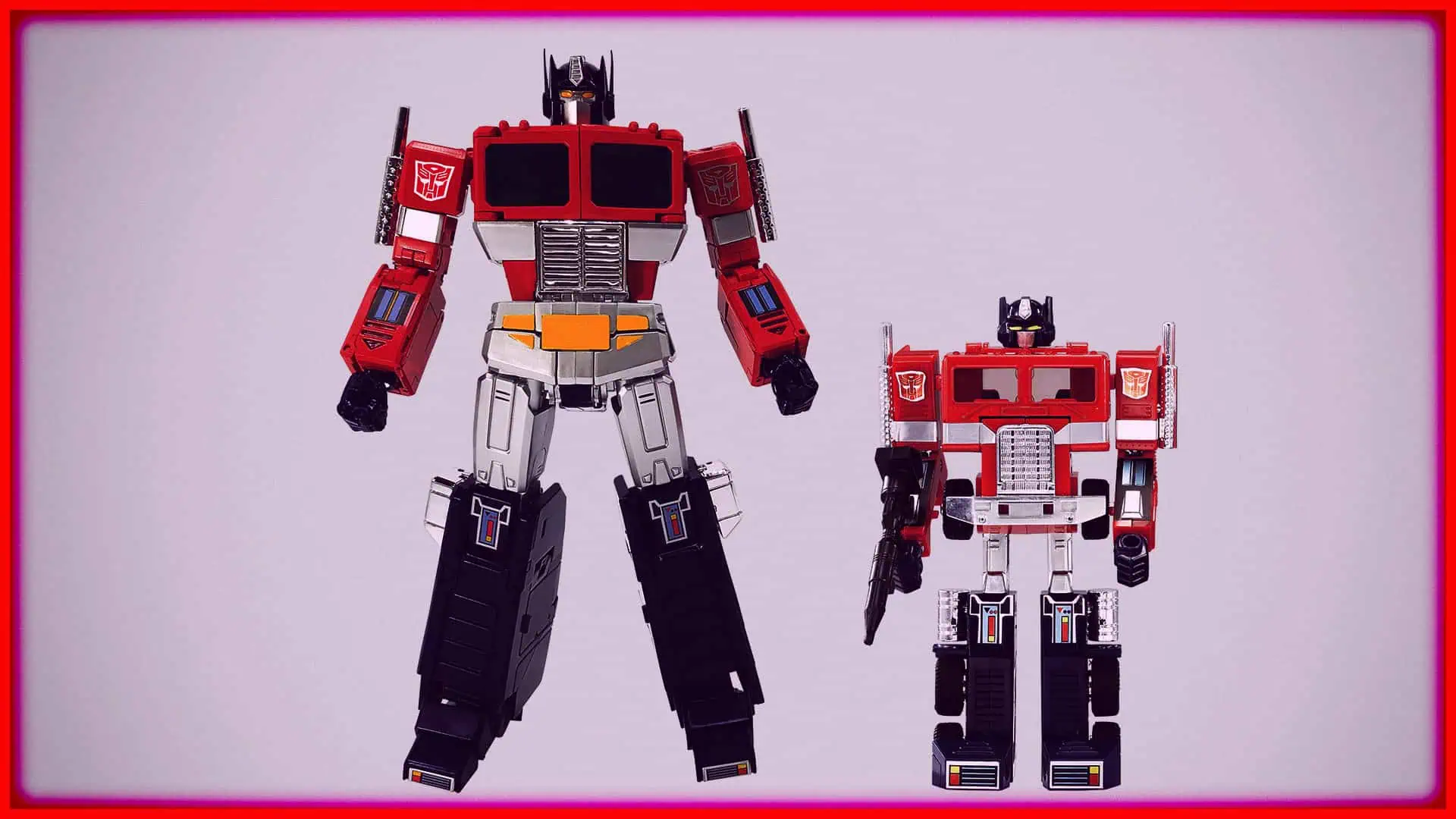 Two Transformers action figures standing side by side on a plain background.