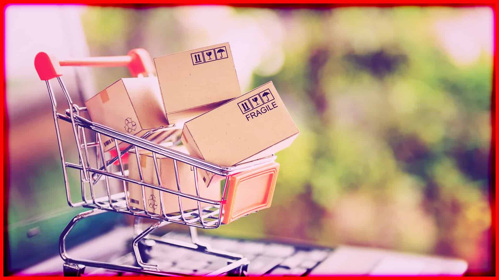 Shopping cart filled with cardboard boxes for online store shipping.