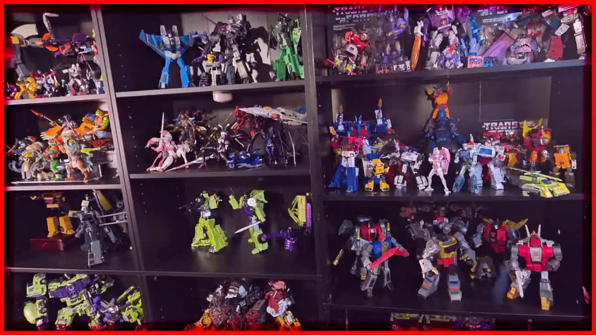 Display of various Transformers and robot toys on black shelves.