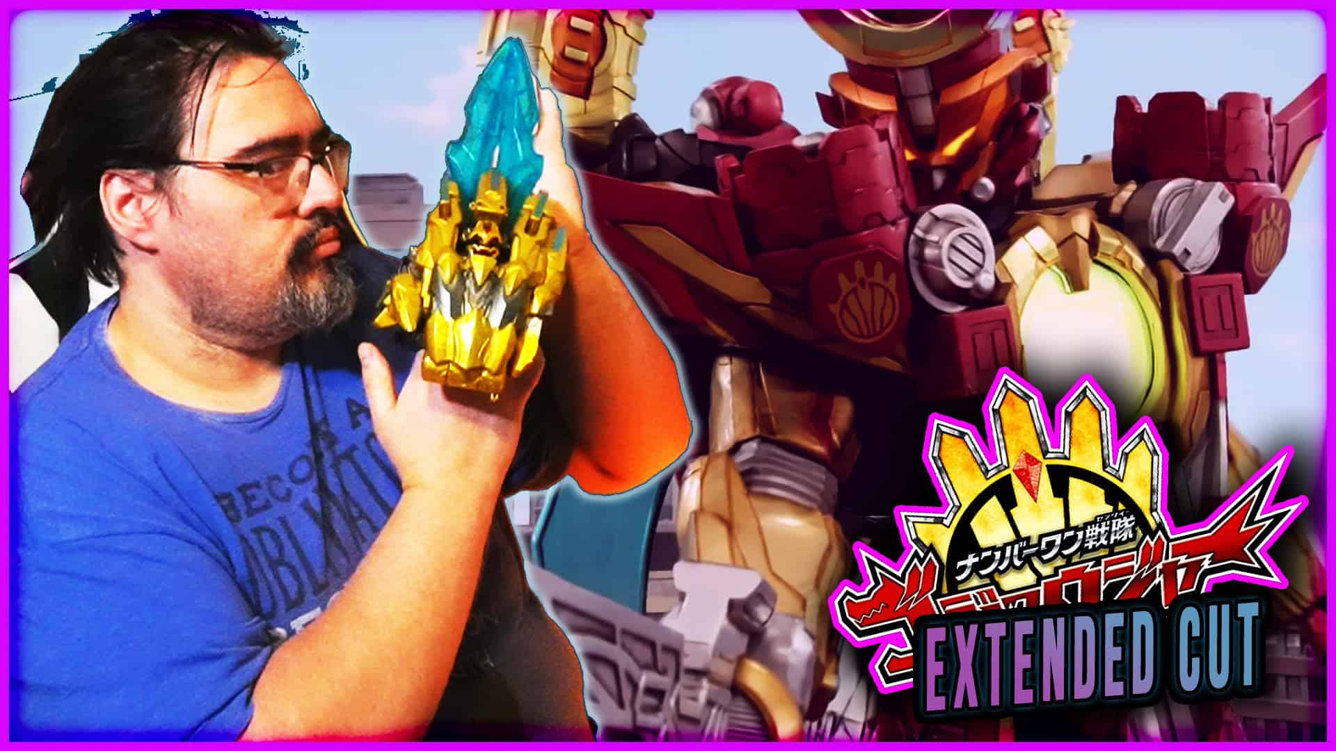 Man holding a blue and gold Majin Planet Gozyuger figure with a giant robot in background.