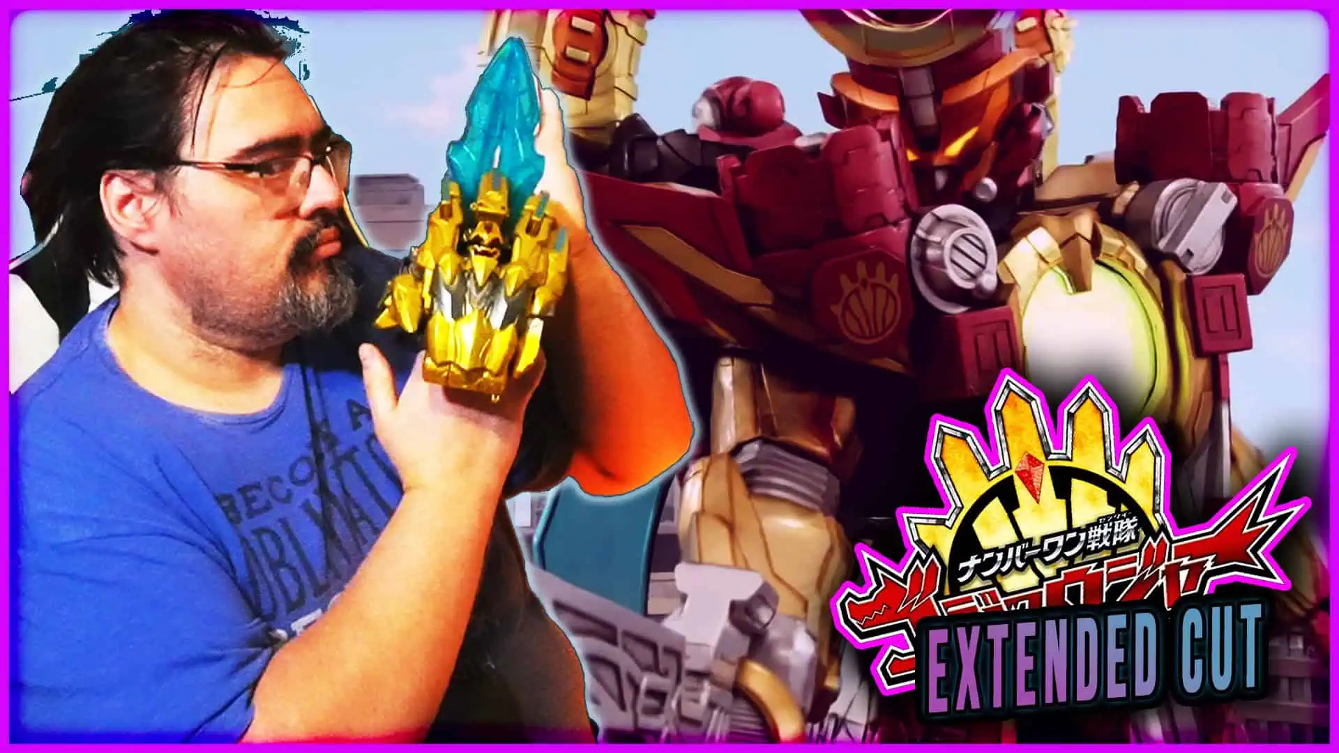 Man holding a blue and gold Majin Planet Gozyuger figure with a giant robot in background.