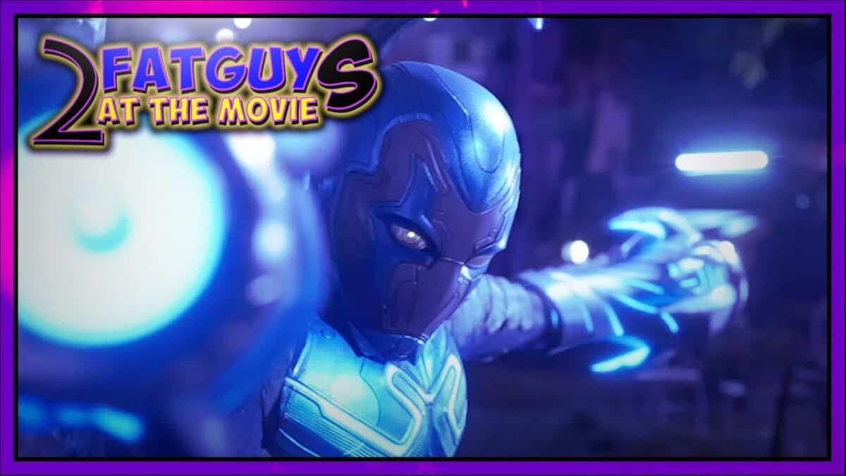 Blue Beetle character in action from the movie, futuristic armor and glowing effects.