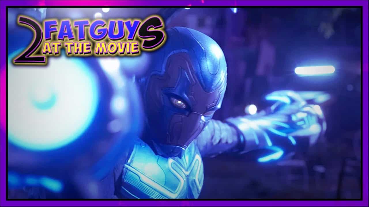 Blue Beetle character in action from the movie, futuristic armor and glowing effects.