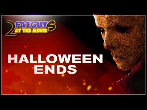 Promotional image for Halloween Ends with a masked character and fiery background.