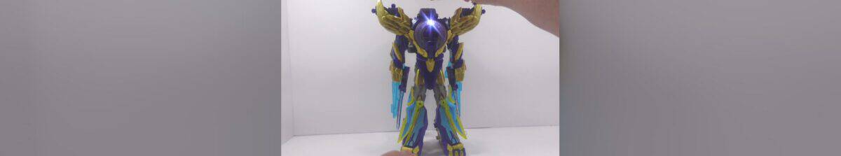 Majin Planet Bruticus Transformer Toy Hand holding a detailed Bruticus Transformer toy with a vibrant pink background.