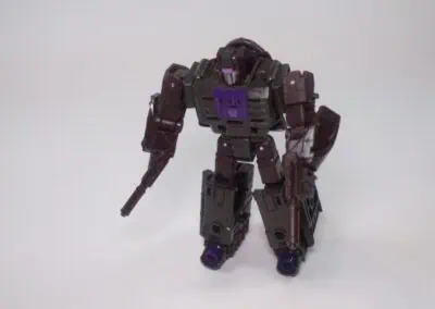 Transformers robot action figure with purple and black color scheme on white background.