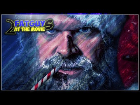 Close-up of Santa Claus with a candy cane in his mouth from Fat Guy 2 at the Movie.