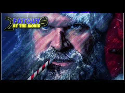 Close-up of Santa Claus with a candy cane in his mouth from Fat Guy 2 at the Movie.